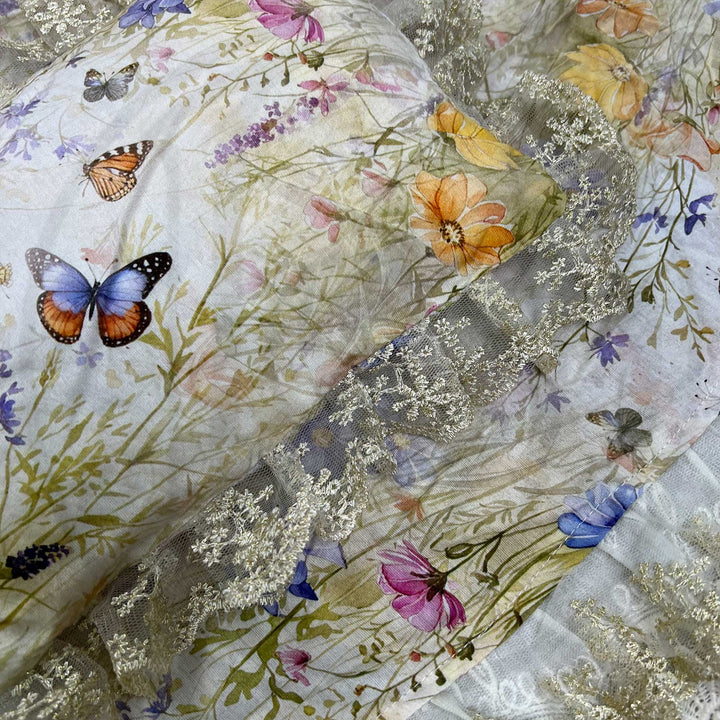 A close-up view of a yellow floral butterfly print lace pillow featuring ruffled lace trim.