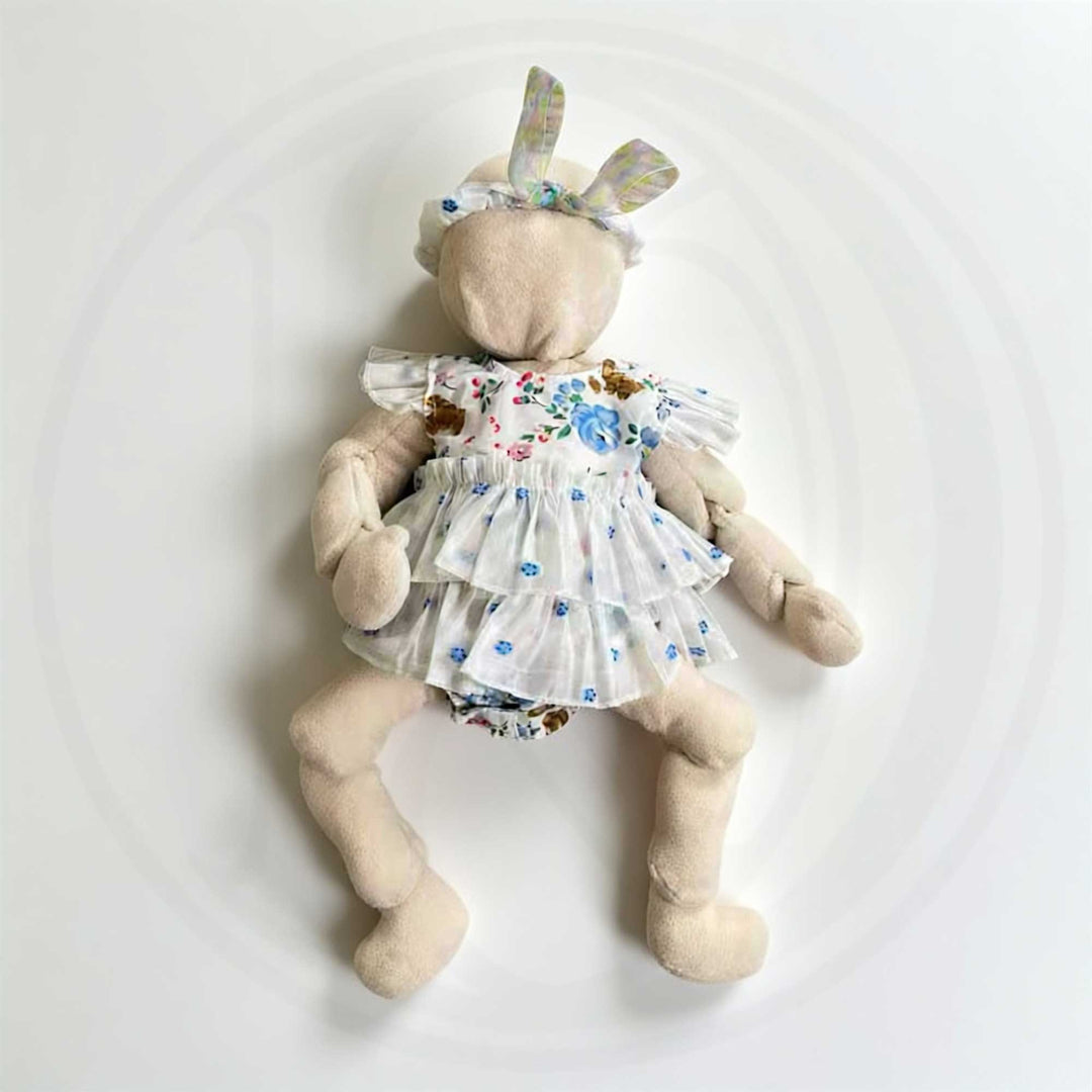 A fleece jointed movable doll available in 54cm and skin tones, for newborn photography.