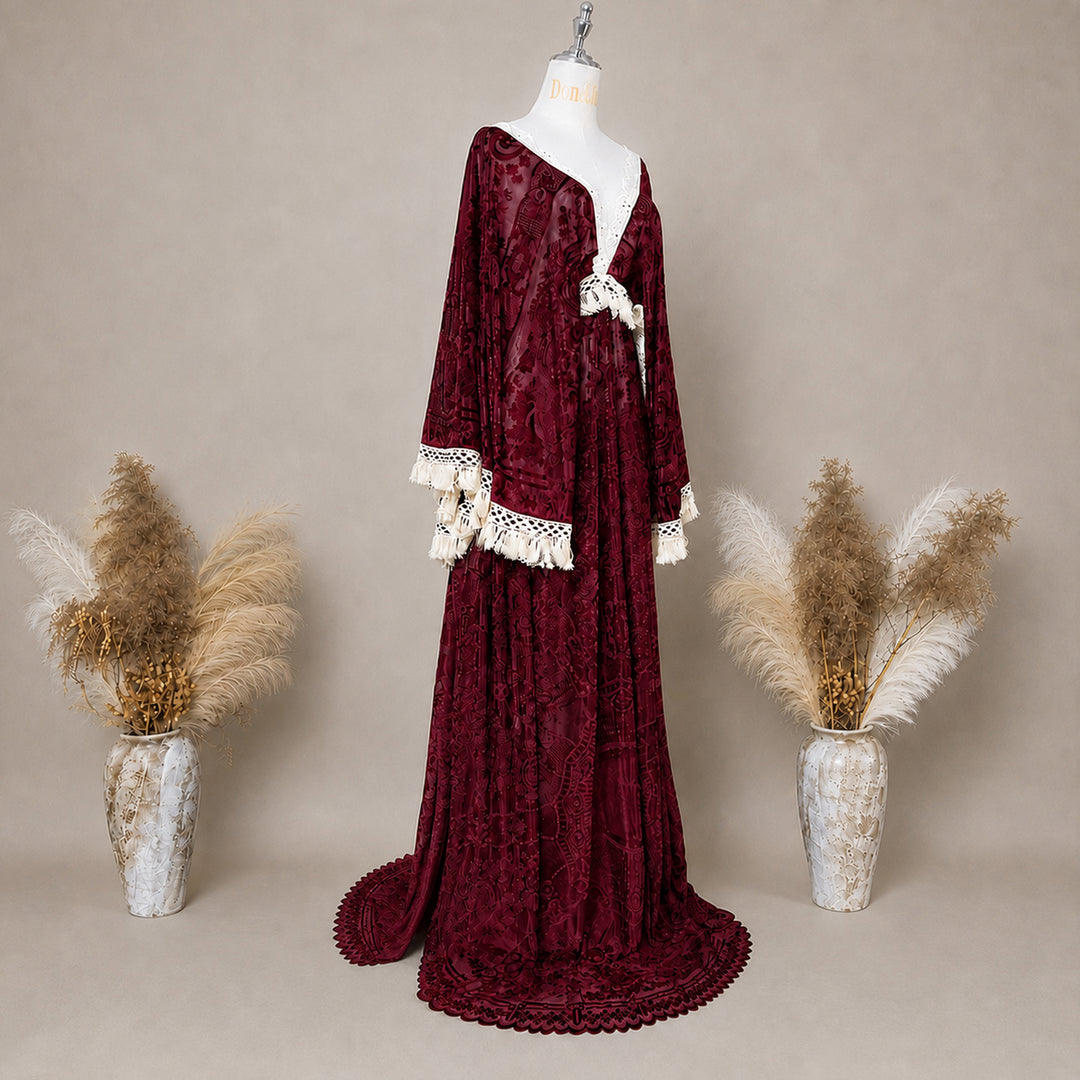 A Red wine,A bacche dress with a velvet is displayed on a mannequin.