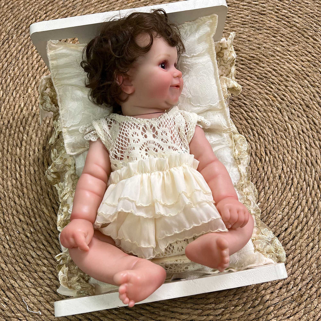 A 2-piece set featuring a newborn blanket and pillow with beige floral print and lace trim for newborn photography.