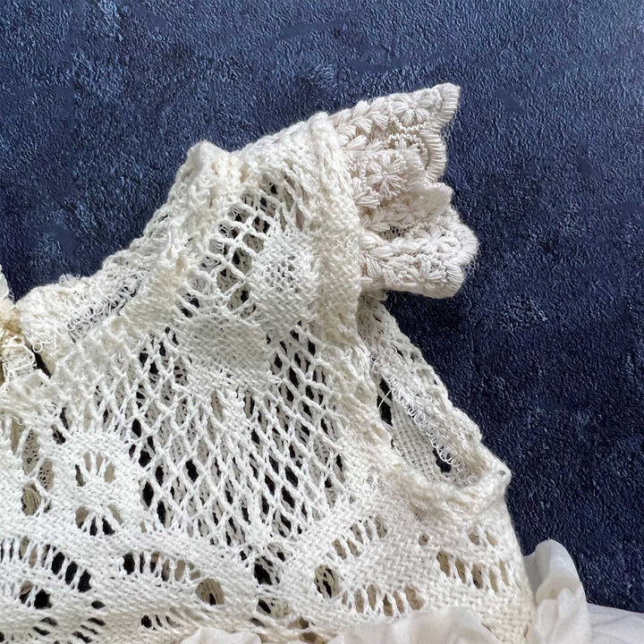 A close-up view of lace double-layer ruffled trim romper.
