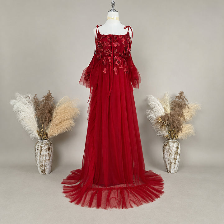 Front view of the Cailleach red tulle Renaissance dress with floral details and a ruffle-trimmed skirt.