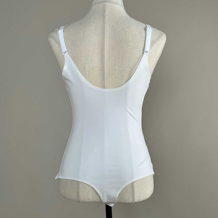 A white Callirrhoe sleeveless bodysuit with a V-neck is displayed on a mannequin.