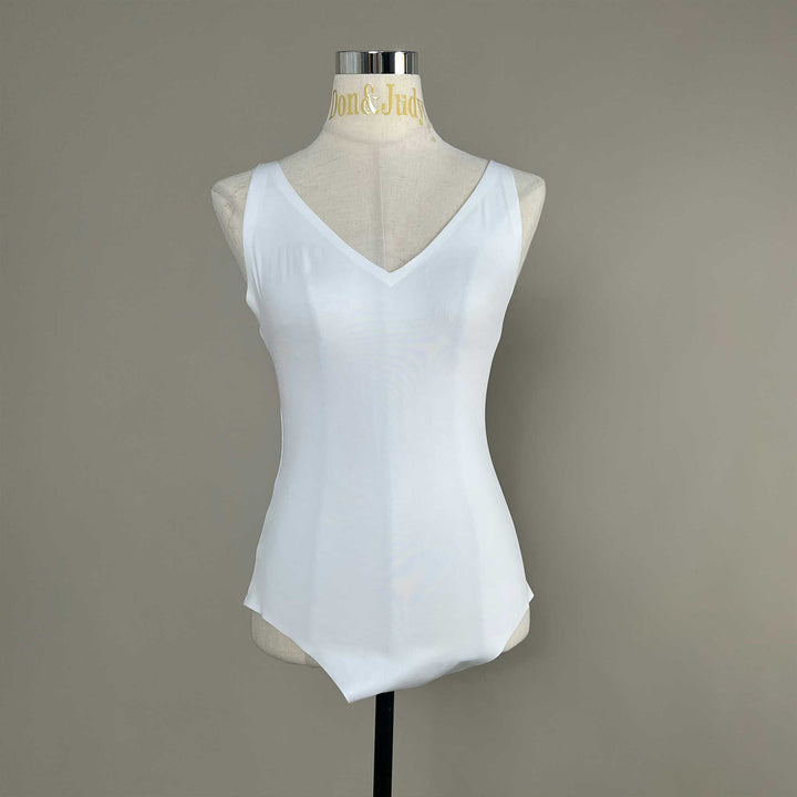 A white Callirrhoe sleeveless bodysuit with a V-neck is displayed on a mannequin.