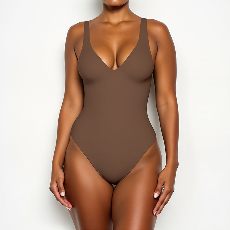 A female model wearing a brown Callirrhoe swimsuit is shown.