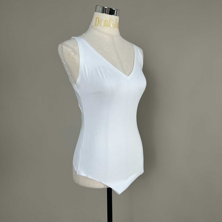 A white Callirrhoe V-neck bodysuit is shown on a mannequin from a side view. 