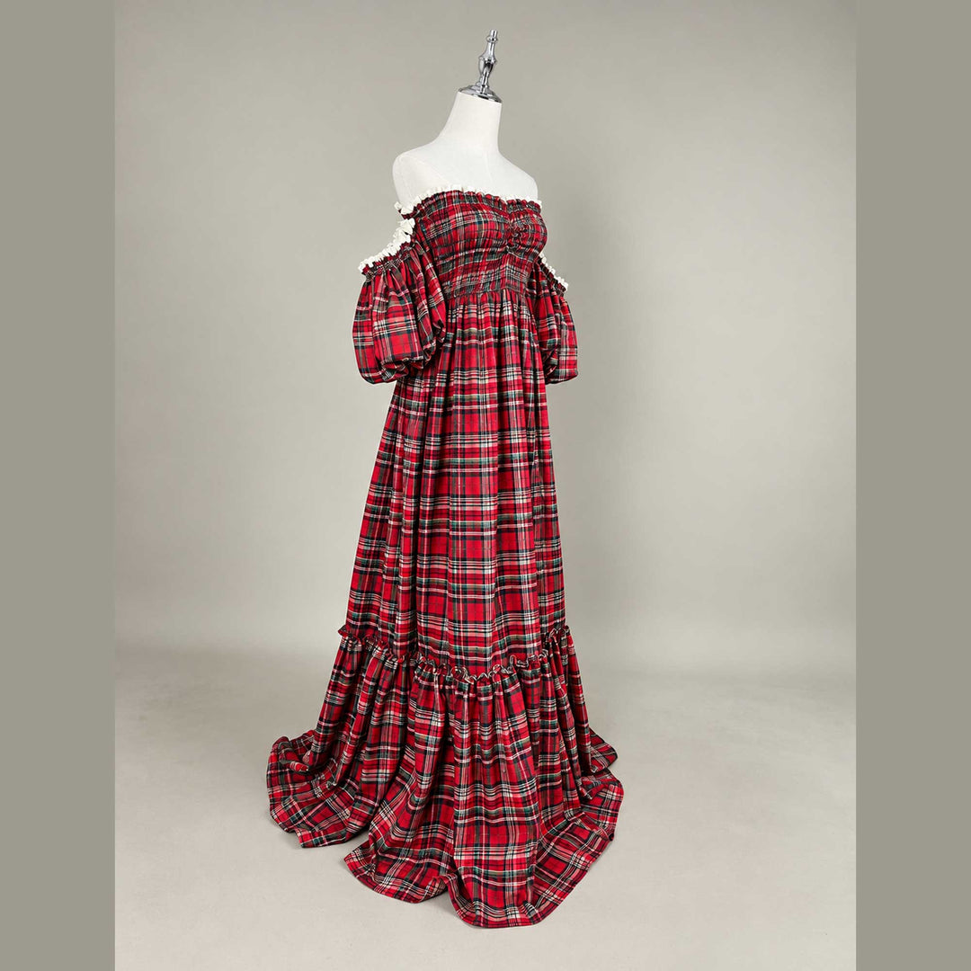 A Catubri plaid dress, showing one puff sleeve, the smocked bodice and the plaid skirt.