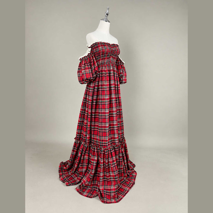 A Catubri plaid dress, showing one puff sleeve, the smocked bodice and the plaid skirt.