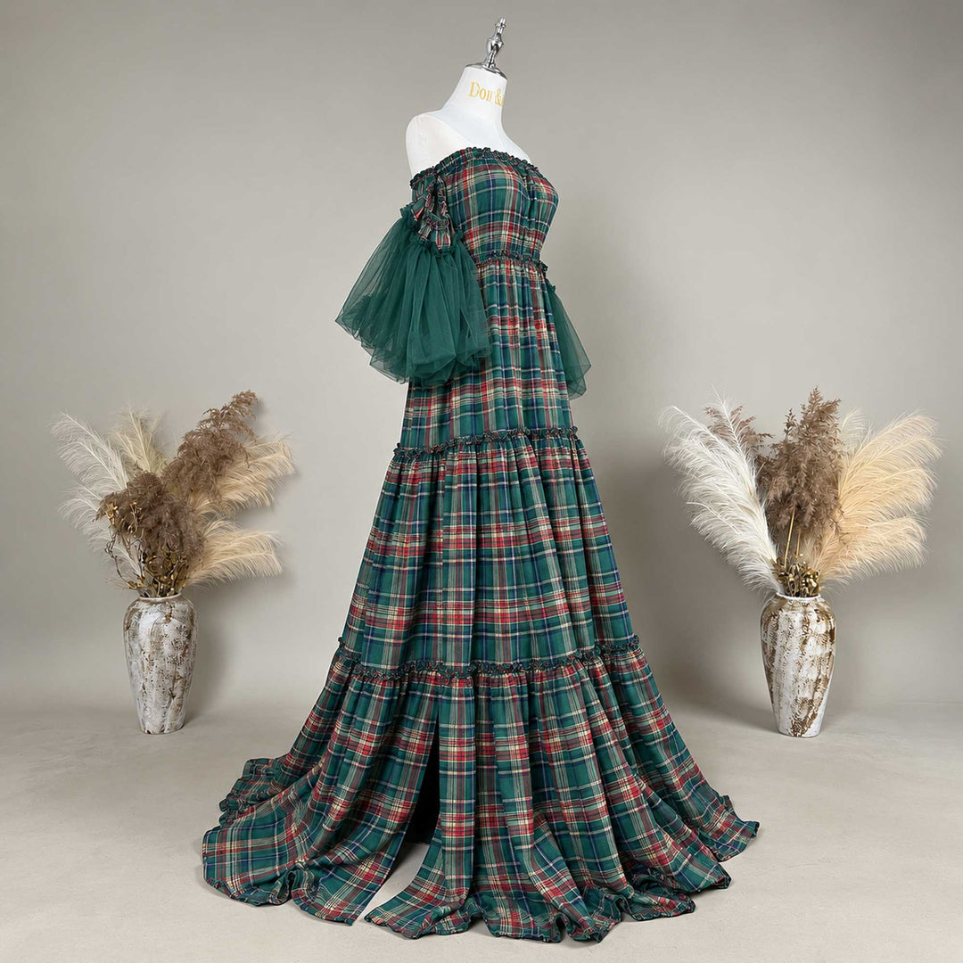 Shot from an oblique side angle,a Celaeno plaid off-shoulder dress with red tulle sleeves on a mannequin.