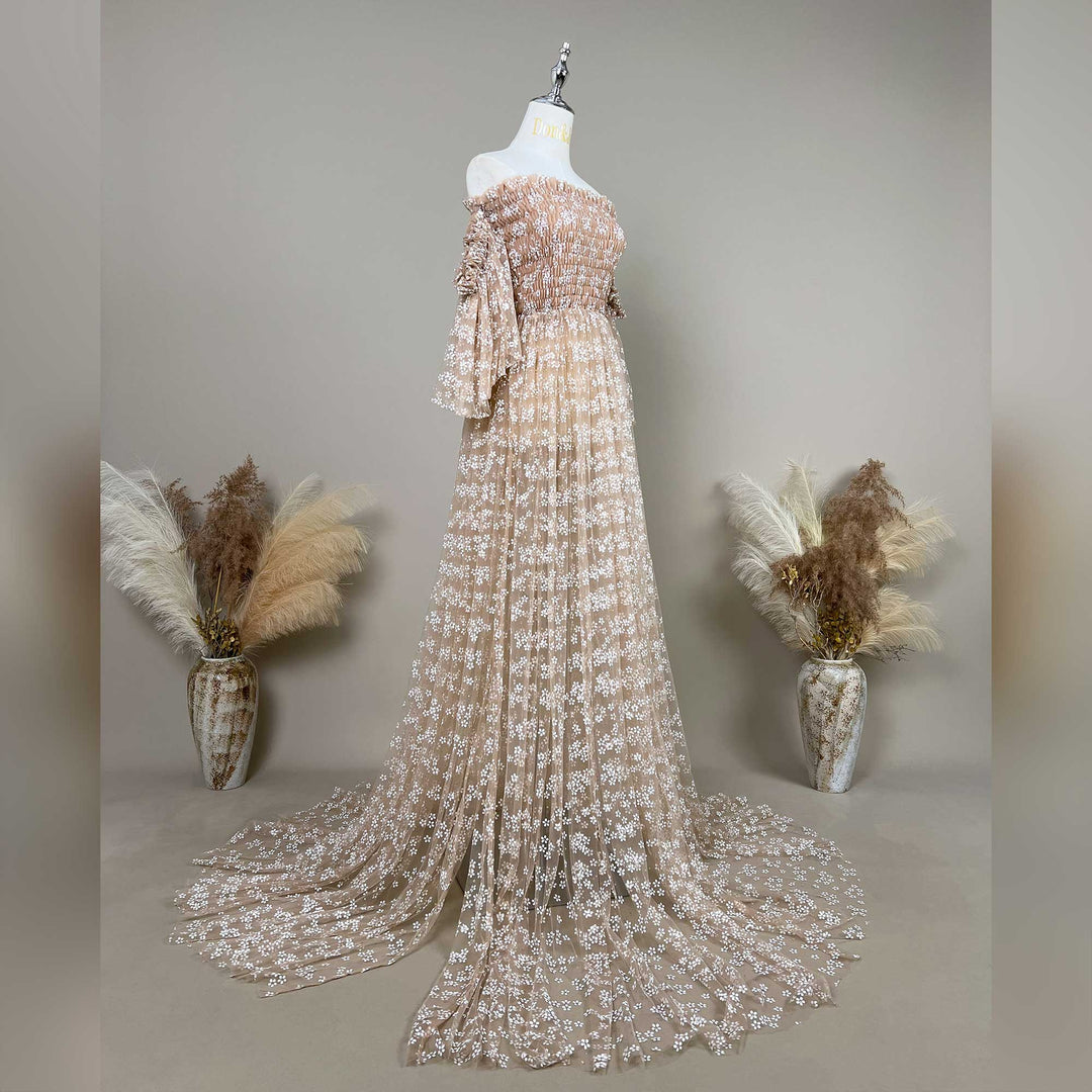 lysianassa dress with floral embroidered off shoulder tulle details is displayed on a mannequin against a neutral gray background