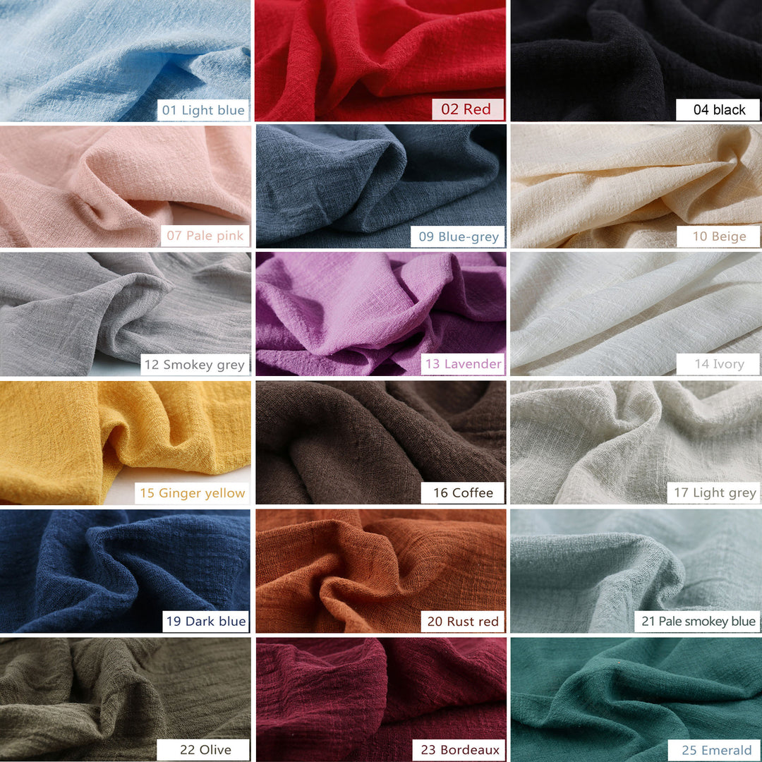 A large grid of small fabric swatches in many colors arranged on a white measurement chart with printed numbers. This is a Megaera dress color-options reference image rather than a single product photo, so subject type is Color Swatch.