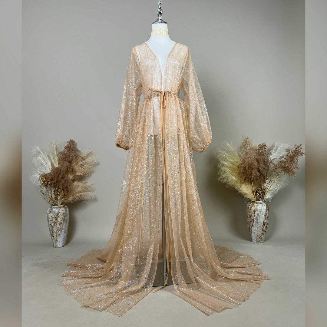 A mannequin displays a khaki sequined V-neck robe with a tie waist and lantern sleeves; the dress features a split train design, set against a solid wall with dried flower vases on both sides.