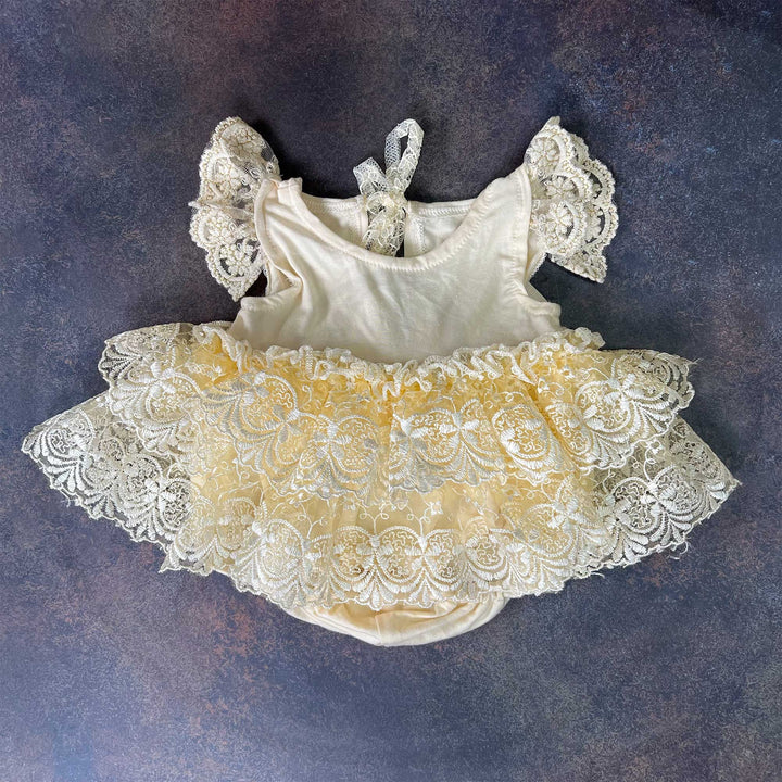 A Modal soft yellow double layer embroidered lace romper for newborn photography props.