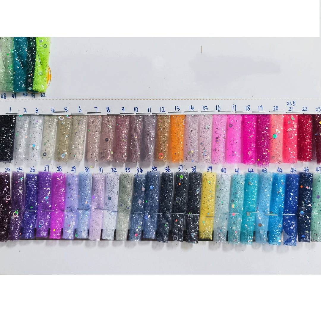 A large grid of small fabric swatches in many colors arranged on a white measurement chart with printed numbers. This is a Nyx dress color-options reference image rather than a single product photo, so subject type is Color Swatch.