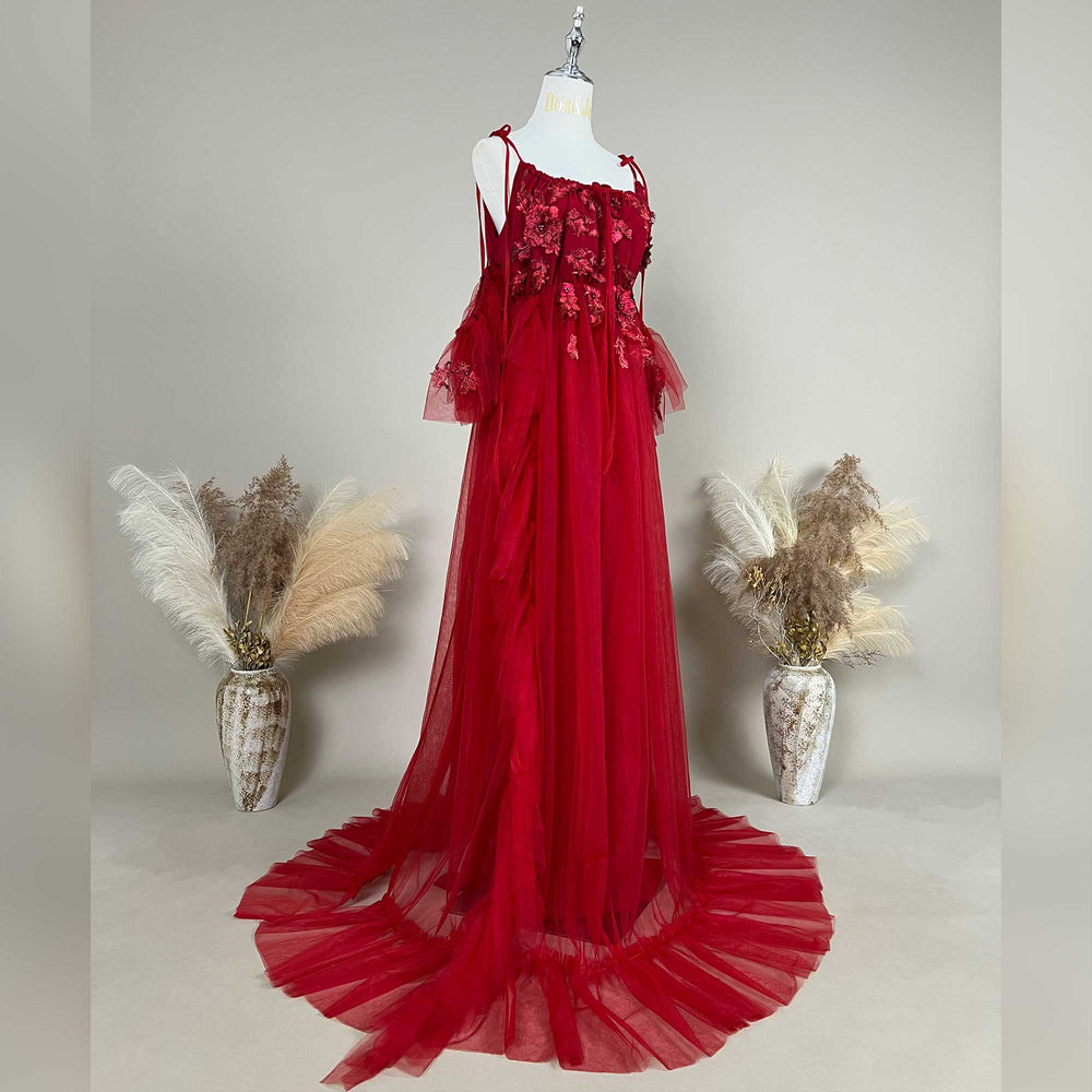 Side view of a pregnant woman wearing the Red floral embroidered off-shoulder tiered ruffle maternity photography dress