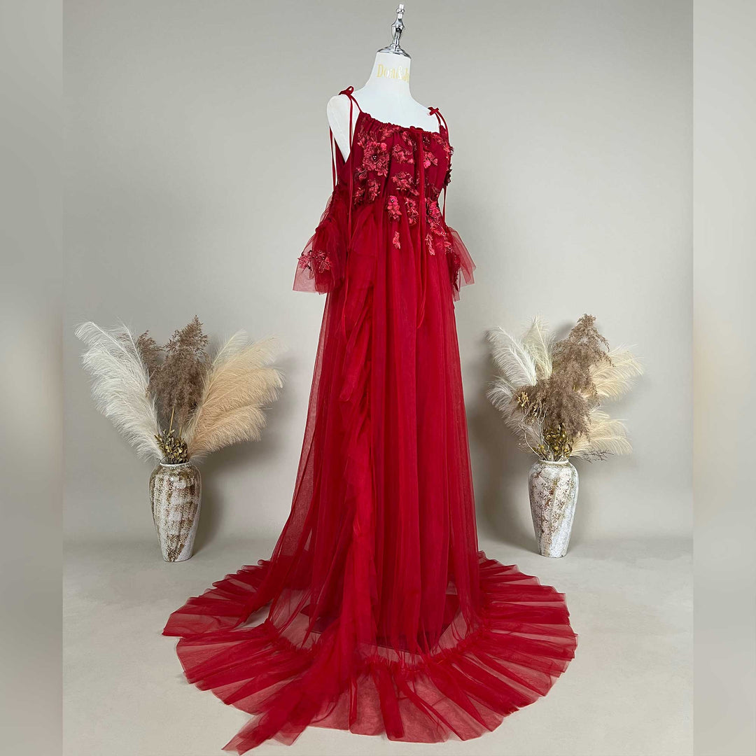 Side view of a pregnant woman wearing the Red floral embroidered off-shoulder tiered ruffle maternity photography dress