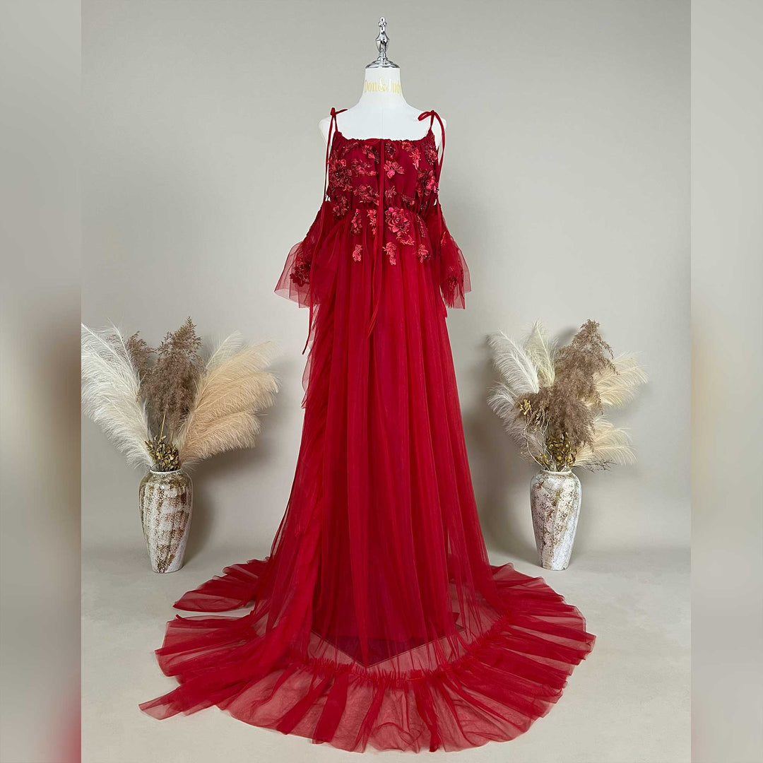 Red floral embroidered off-shoulder tiered ruffle maternity photography dress on a mannequin.