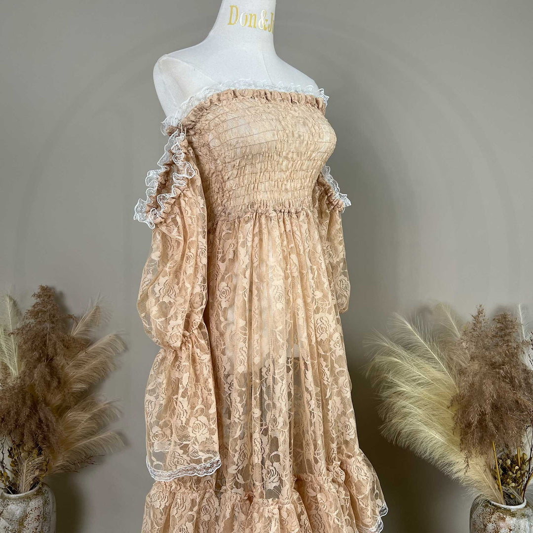 A khaki lace off-shoulder dress is displayed on a mannequin, featuring a shirred bodice, tiered ruffled sleeves, and rose patterns