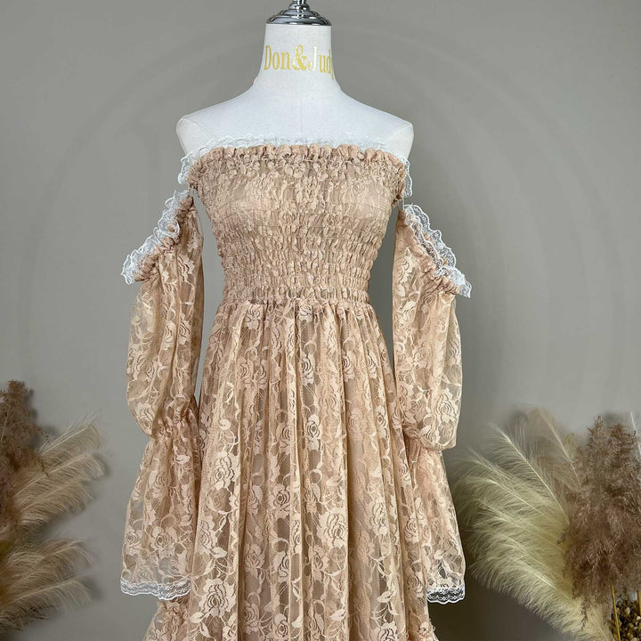A khaki lace off-shoulder dress is displayed on a mannequin, featuring a shirred bodice, tiered ruffled sleeves, and rose patterns.